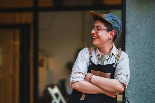Female Barista opening her coffee shop in the morning. stock photo