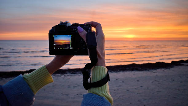 istock Photographing a beautiful sunset with a camera. 1673428936