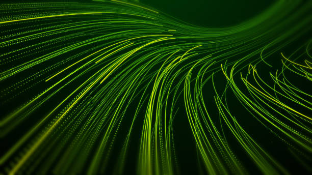 istock Abstract Green particle light trails on dark background 1673433353