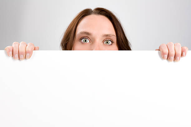 istock Girl holding sign or board on gray 167348703
