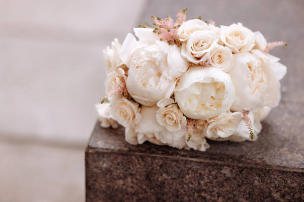 istock Wedding bouquet of roses on a stone 1673498185