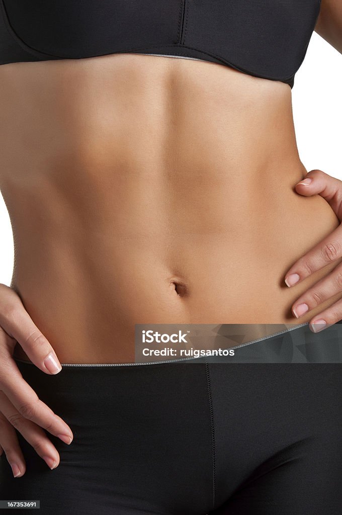 Woman's Abs Closeup of a fit woman's abs isolated on a white background Abdomen Stock Photo