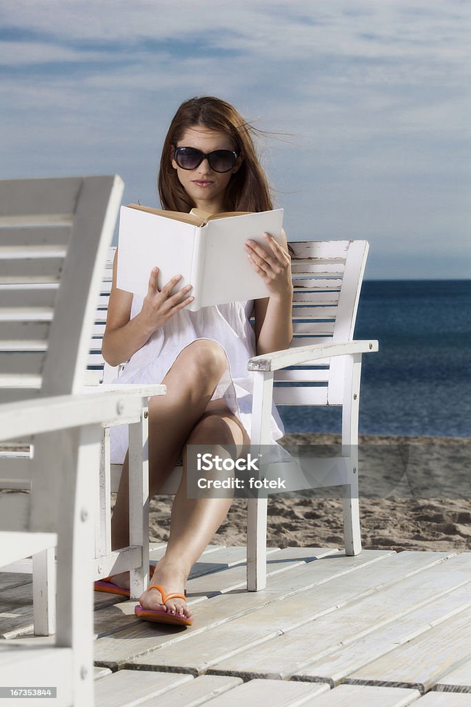 Woman relaxing on the beach Preety young woman relaxing on the beach 2013 Stock Photo