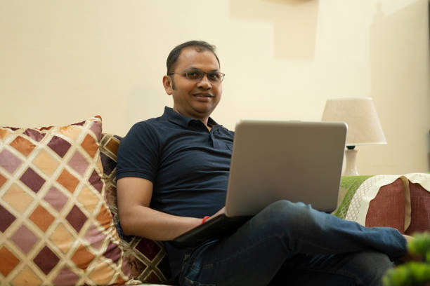 istock Young Indian man working on laptop from home 1673547228