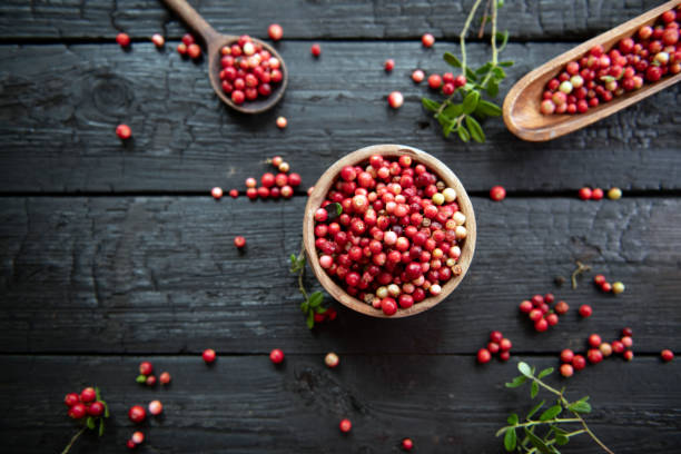 istock Red cranberries on wooden background. 1673560790