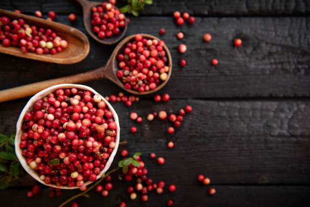 istock Red cranberries on wooden background. 1673560870