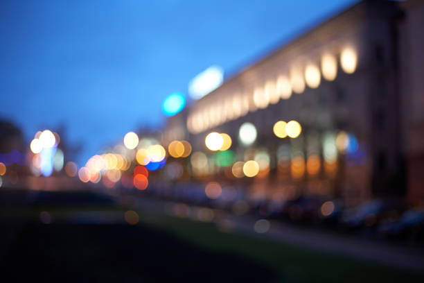 Bokeh from street lights and buildings at night in the city.