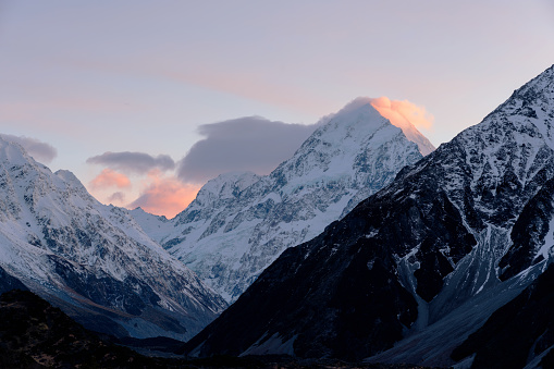The first light of a new day falls upon the peak of Mt Cook/Aoraki, on New Zealand's South Island.