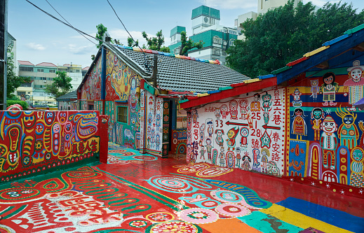 Taichung, Taiwan - September 05, 2023 : Rainbow Village, The colourful chinese graffiti painted on the wall. It is a famous sightseeing spot in Taichung, Taiwan.