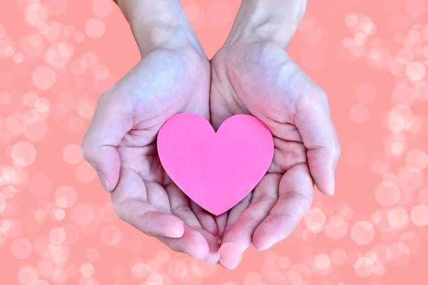istock A hand that wraps around the heart of peace 1673584199