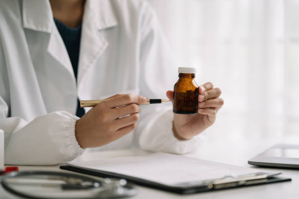 istock Pharmacists or doctors study information about tablets in the room 1673589619