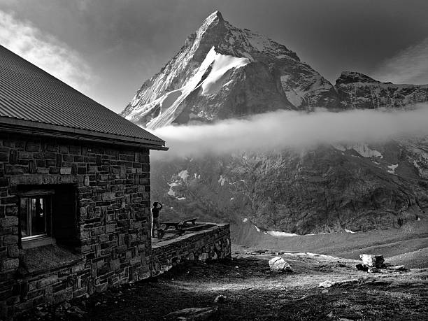 Taken from Schonbielhutte (2694m) four hours hike from Zermatt, Switzerland. The person taking the picture in the foreground is a Sherpa from Nepal who stayed overnight at the hut whose unplanned presence really makes this shot.
