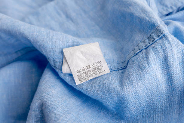 istock Clothing label on light blue garment, top view 1673623005
