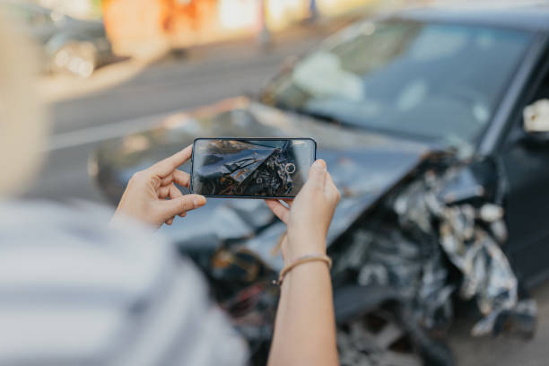 istock Taking photo of wrecked car 1673624637