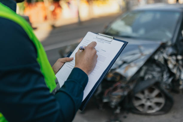 istock Man working on the insurance claim report 1673625704