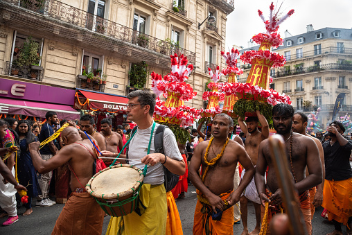 Paris, France - August 27, 2023: Drummers and dancers at procession during festival of the god Ganesh. The Hindu and Tamil community celebrates the birthday of god-elephant Ganesh, Ganesh Chaturthi.