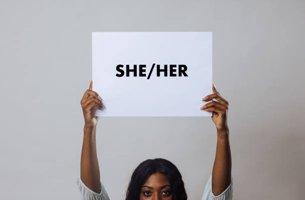 istock Holding up Pronoun Placard 1673642820