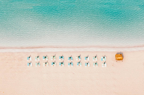 istock heavenly beach with beach umbrellas 1673667040