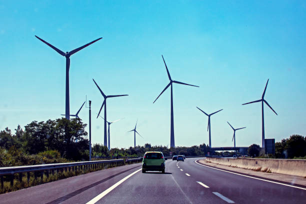 istock Autobahn through windmills. Energy saving. Global energy crisis. Ecological fuel 1673667555