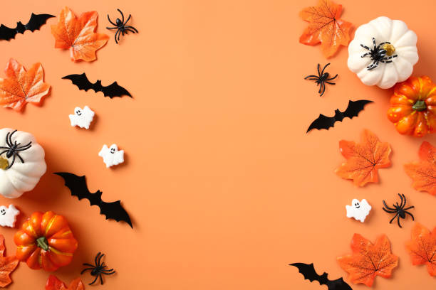 istock Halloween holiday background with pumpkins, bats, maple leaves, spiders. Halloween party invitation design. 1673668607