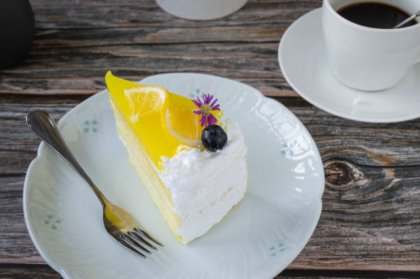 istock Lemon cake in a plate with hot black coffee 1673676771