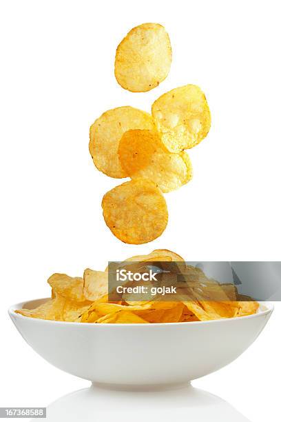 Potato Chips Stock Photo - Download Image Now - Potato Chip, Falling, Bowl