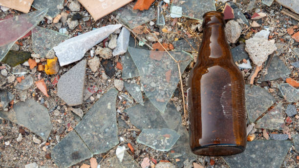 istock Construction waste and an empty  beer bottle on the ground 1673689709