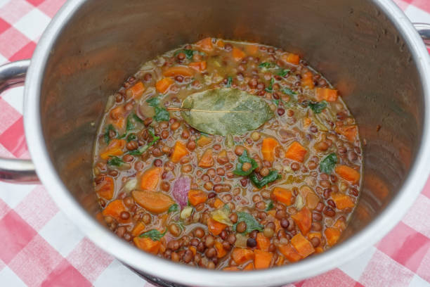 istock Green lentils cooked with vegetables in portions in a casserole dish 1673709934