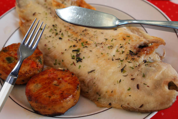 istock Sole cooked with dried seaweed and served with vegetable croquettes 1673716539