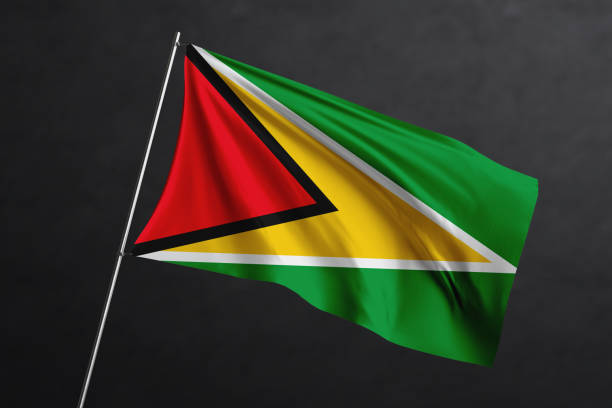 istock 3D Waving flag design. Guyana National flag on black background. 1673722428