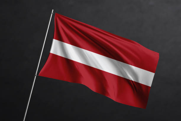 istock 3D Waving flag design. Latvia National flag on black background. 1673724335