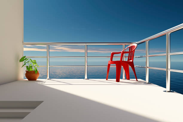 A beautiful view of the ocean from the veranda of a snow-white villa located on the shore.