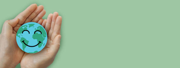 istock Hand holding paper cut saving clean energy earth globe world environment green eco friendly, save planet, csr social responsibility.campaign save the earth and earth Day 22 April 1673732124