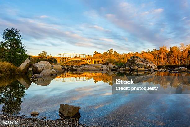 Rainbow Bridge And Clouds Reflecting In The Water Stock Photo - Download Image Now - Sacramento, California, American River