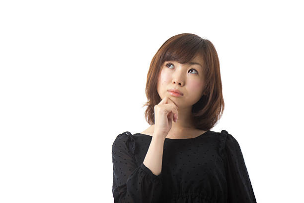 istock Asian Woman Thoughtfully Holding Chin 167374600