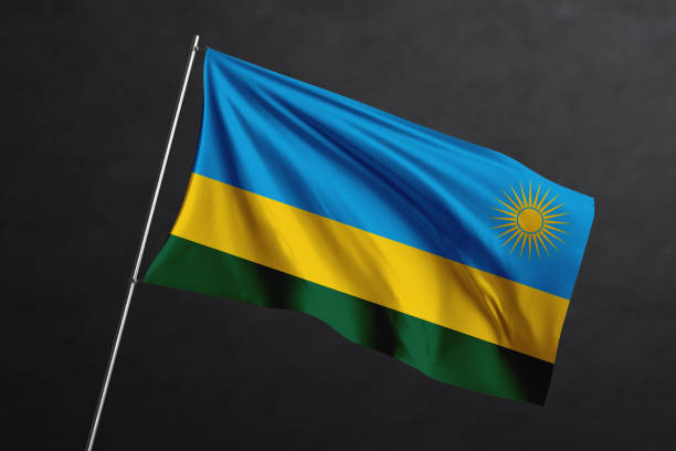 istock 3D Waving flag design. Rwanda National flag on black background. 1673747315