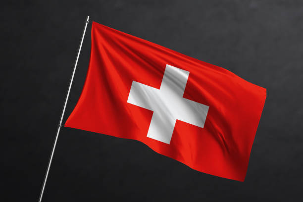 istock 3D Waving flag design. Switzerland National flag on black background. 1673748963