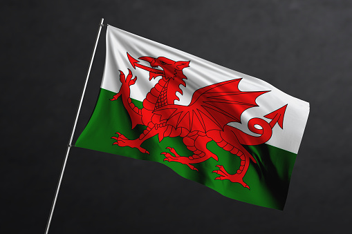 3d illustration flag of Wales. Wales flag waving isolated on black background with clipping path. flag frame with empty space for your text.