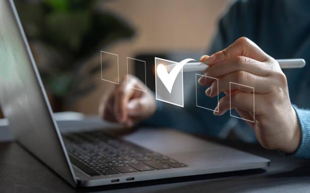 Human hand with checking mark on checklist, checklist survey, check mark, yes, questionnaire, filling digital, list, assessment, exam, vote, answer, to do list, planning, business and verification concept