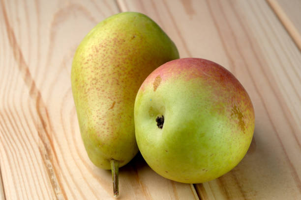 istock Sweet ripe pears on a wooden light table 1673783824