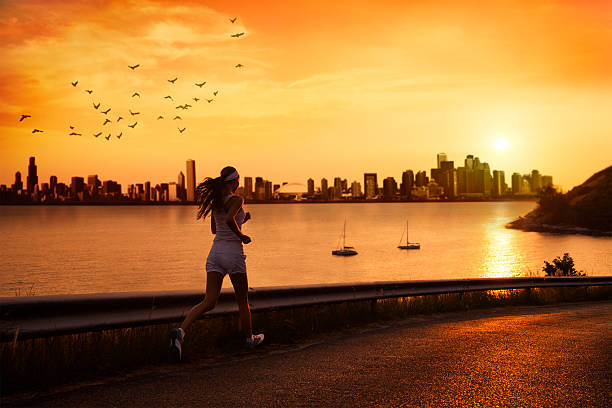 istock Young woman running at sunset 167378667