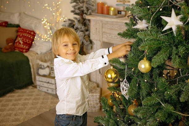 istock Cute child, boy, playing in a decorated room for Christmas 1673789868