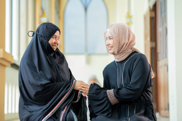 istock Two good-looking Asian Muslim women, hello, greeting, 1673800302