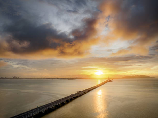 istock Drone view of Penang Bridge during golden hour 1673800898