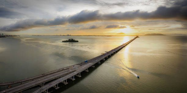 istock Drone view of Penang Bridge during golden hour 1673800932