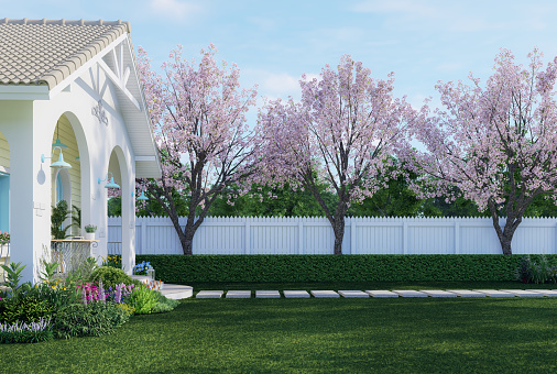 Vintage style tiny house with empty green lawn for copy space 3d render there white plank fence decorate garden with colorful flower plant