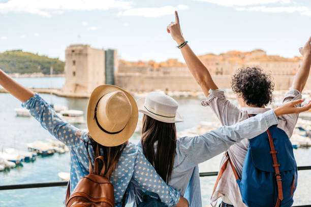 istock Three Young Friends Enjoying The View In Dubrovnik Bay 1673827543