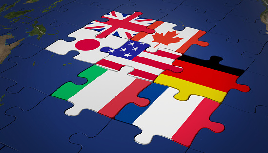 concept of group of seven or g7 jigsaw puzzle flag on blue background. group of seven or g7 jigsaw puzzle background. group of seven or g7 jigsaw puzzle 3d render