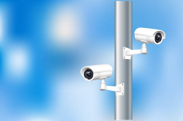 istock Close up of CCTV camera over defocused background. Security monitoring system for smart home, company. Vector 1673840775