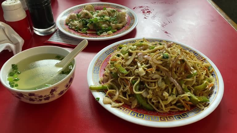 Close up shot of tasty Tibetan dishes on a table inside a restaurant in Kolkata, India.